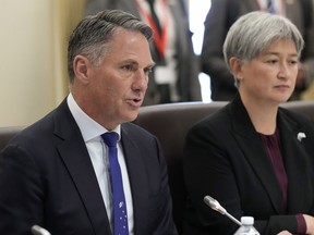 Australia's Deputy Prime Minister and Defence Minister Richard Marles, left, speaks alongside Australia's Foreign Minister Penny Wong during an Australia and South Korea Foreign and Defence Ministers meeting in Melbourne, Australia, on May 1, 2024. Australia has protested to Beijing that a Chinese fighter jet endangered an Australian navy helicopter with flares in international waters, the defense department and news media have reported, Monday, May 6, 2024.