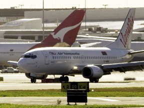 An Air Vanuatu plane makes an emergency landing at Sydney Airport, August 2, 2001, after suspected under carriage damage. Air Vanuatu announced on Thursday, May 9, 2024, the airline had cancelled international flights for four days and was considering bankruptcy protection for the South Pacific state-owned carrier.