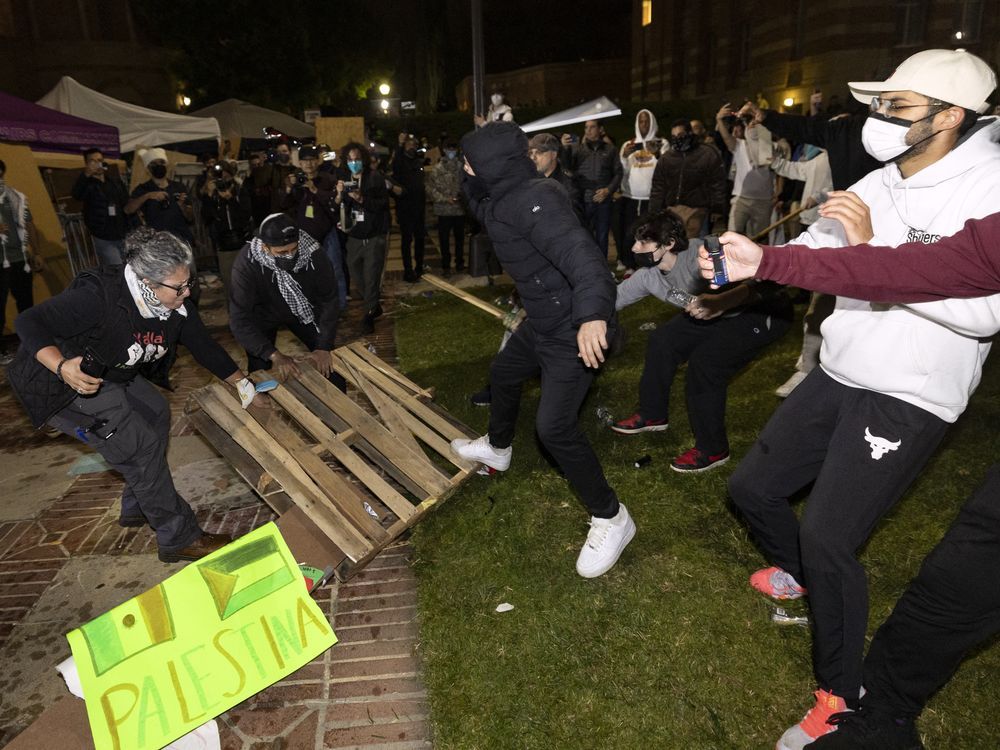 NextImg:Dueling protest groups clash overnight at UCLA