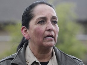 Salt Lake County Sheriff Rosie Rivera speaks to reporters at a staging area at Hidden Valley Park, Thursday, May 9, 2024, in Sandy, Utah. Two skiers were killed and one was rescued after an avalanche in the mountains outside of Salt Lake City. The slide happened after several days of spring snowstorms.