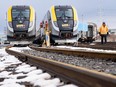 New passenger trains sit on the tracks at the Via Rail Canada Maintenance Centre in Montreal, Thursday, Feb. 22, 2024.