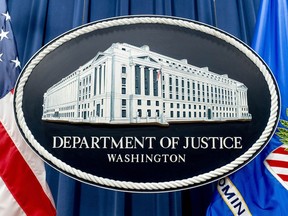 FILE - The seal for the Justice Department is photographed in Washington, Nov. 18, 2022. The Justice Department has announced three arrests in a complex stolen identity scheme that officials say generates enormous proceeds for the North Korean government, including for its weapons program.