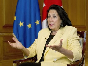 Georgian President Salome Zourabichvili gestures while speaking during an interview with The Associated Press, in Tbilisi, Georgia, Thursday, May 16, 2024. Zourabichvili said Thursday that a "foreign influence" bill passed by parliament that critics call a threat to free speech is "unacceptable."