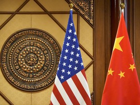 Flags of the U.S and China sit in a room where U.S. Secretary of State Antony Blinken meets with China's Minister of Public Security Wang Xiaohong at the Diaoyutai State Guesthouse, Friday, April 26, 2024, in Beijing, China.