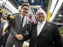 Prime Minister Justin Trudeau shakes hands with Ontario Premier Doug Ford during an event at the Honda of Canada Manufacturing Plant 2 in Alliston, Ontario, on April 25, 2024.