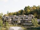 An hour west of Ottawa, 97 modernist townhouses and stacked condo units are coming to the community planned for 700 acres of hillside above the ski resort of Calabogie Peaks.