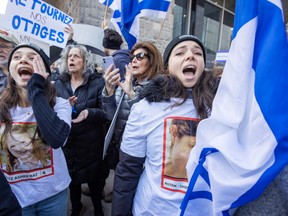 Ora Bar, right, takes part in an antisemitism rally organized by Hillel and StartUp Nation outside Concordia University’s Hall building, in Montreal on Nov. 16, 2023.