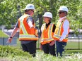 Calgary Mayor Jyoti Gondek and Ward 7 Coun. Terry Wong spek with a city worker at the scene of a water main break in Montgomery on Thursday, June 6, 2024.