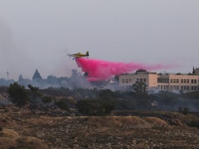 firefighting aircraft drops flame retardant