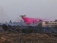 firefighting aircraft drops flame retardant