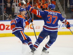 Edmonton Oilers forwards Ryan McLeod and Warren Foegele celebrate after McLeod's goal during the third period of Game 6 of the 2024 Stanley Cup Final against the Florida Panthers at Rogers Place on June 21, 2024 in Edmonton.
