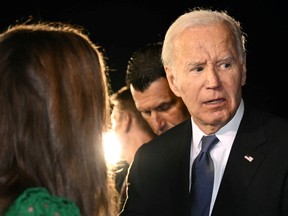 U.S. President Joe Biden speaks to supporters gathered on the tarmac upon his arrival at Raleigh-Durham International Airport in Morrisville, North Carolina, early on June 28, 2024.