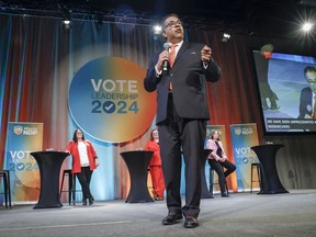 Alberta NDP leadership candidate Naheed Nenshi, right, makes an opening statement as fellow candidates, left to right, Gil McGowan, Jodi Calahoo Stonehouse, Sarah Hoffman, and Kathleen Ganley look on during a leadership debate in Calgary, Alta., Saturday, May 11, 2024.