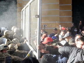 Bolivian citizens clash with police.