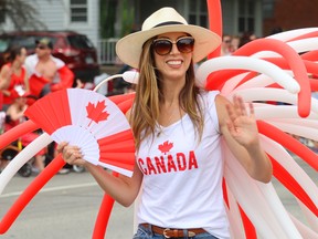 A woman dressed in red and white for Canada Day.