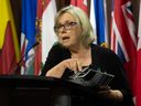 Green Party leader Elizabeth May speaks at a news conference while referencing a copy of a public security report, in Ottawa, Tuesday, June 11, 2024.