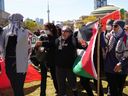 A counter-protester, centre, is forced out of the anti-Israel encampment set up on the University of Toronto campus on May 2.