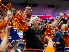 Fans cheering for the Edmonton Oilers.