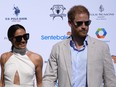 Britain's Prince Harry, right, and wife Meghan Markle