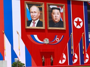 Giant portraits of Vladimir Putin and Kim Jong Un.