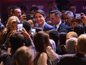 Prime Minister Justin Trudeau takes pictures with participants after his speech at the leaders talk of the ASEAN-Indo Pacific Forum