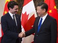 Prime Minister Justin Trudeau meets Chinese President Xi Jinping in Beijing on Dec. 5, 2017.