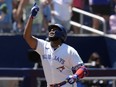 Toronto Blue Jays' Vladimir Guerrero Jr. celebrates after hitting a three-run home run off Baltimore Orioles pitcher Cade Povich during third-inning American League MLB baseball action in Toronto on Thursday June 6, 2024.