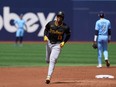 Pittsburgh Pirates third base Ke'Bryan Hayes (13) rounds the bases after hitting a two run home run against Toronto Blue Jays pitcher Yusei Kikuchi during first inning interleague MLB baseball action in Toronto on Saturday, June 1, 2024.