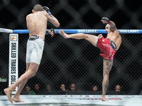 Charles Jourdain, right, fights Sean Woodson during the featherweight bout at UFC 297 in Toronto on Saturday, January 20, 2024.
