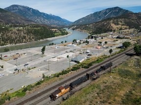 A CPKC firefighting train sits on the tracks above the village of Lytton, B.C., on Tuesday, June 25, 2024. Mayor Denise O'Connor shared an update on the rebuilding progress Tuesday, ahead of the third anniversary of the fire that destroyed 90 per cent of the community.