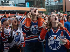 Edmonton Oilers fans react to a goal against the Oilers in Edmonton on Monday June 24, 2024. The Edmonton Oilers lost to the Florida Panthers in Game 7 of the NHL Stanley Cup final.