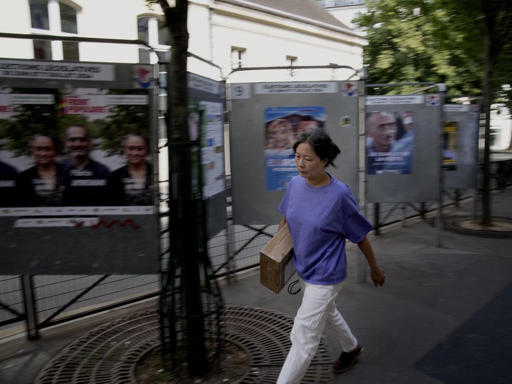 NextImg:The Latest 5/8 Polls are open in France's early legislative election