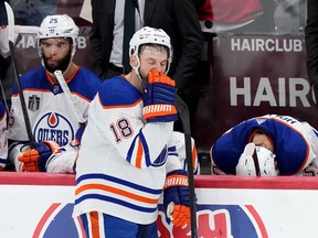 Edmonton Oilers forward Zach Hyman (18), defenceman Darnell Nurse (25) and forward Dylan Holloway (55) react after losing to the Florida Panthers in game 7 of the NHL Stanley Cup finals in Sunrise, Fla., on Monday, June 24, 2024.