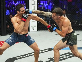 Canadian lightweight Michael Dufort, left, absorbs a punch from American Adam "The Bomb" Piccolotti on the PFL 5 undercard in Salt Lake City, Utah, in a Friday, June 21, 2024, handout photo.