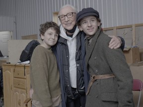 Maxwell Smart, a 94 year-old Holocaust survivor, is shown in an undated handout photo alongside "The Boy in the Woods" actors David Kohlsmith, left, and Jett Klyne. Smart was just 11 years old when he escaped Nazi persecution in eastern Europe by learning to live alone in a forest. Smart's harrowing tale is brought to life in "The Boy in the Woods," a Canadian film, out Friday, based on his 2022 memoir of the same name.