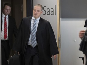 Lawyers Florian Gempe, left, and Ralf Hornemann enter the courtroom in the Halle district court, Germany, Monday June 24, 2024. Both lawyers are representing Bjorn Hocke, chairman of the Thuringian AfD. Hocke has gone on trial for the second time on charges of knowingly using a Nazi slogan at a political event.