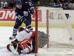 Toronto Maple Leafs' Sergei Berezin scores on Ottawa Senators goalie Patrick Lalime during first period NHL action in Ottawa Saturday, April 7, 2001. Sergei Berezin, who played five of his seven NHL seasons with Toronto and was a reliable scorer for the Maple Leafs, has died at 52.