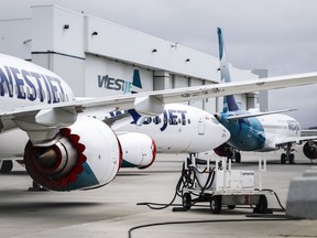 WestJet Boeing 737 Max aircraft are shown at the airline's facilities in Calgary, Alta., Tuesday, May 7, 2019. WestJet is cancelling flights ahead of a possible strike its mechanics union.