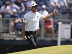 Corey Conners, of Canada, gestures on the third hole during the third round of the U.S. Open golf tournament Saturday, June 15, 2024, in Pinehurst, N.C.