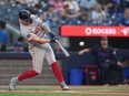 Boston Red Sox designated hitter Tyler O'Neill hits a solo home run against Toronto Blue Jays pitcher Yusei Kikuchi during first inning American League MLB baseball action in Toronto on Monday, June 17, 2024.