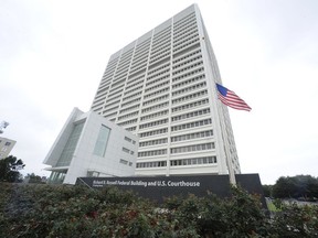 FILE - The Richard B. Russell Federal Building stands, July 21, 2012, in Atlanta. A new federal lawsuit challenges a Georgia law that expands cash bail and restricts organizations that help people pay bail so they can be released while their criminal cases are pending.