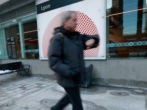 A man walks by Lyon Station in downtown Ottawa on Dec. 20, 2022.