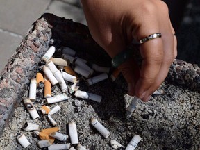 An internal review of the government's anti-tobacco legislation shows the federal approach to curb nicotine use in Canada isn't working, but Physicians for a Smoke-Free Canada say the Liberals have promised no action to fix it.A smoker puts out a cigarette in a public ash tray in Ottawa on Tuesday, May 31, 2016.