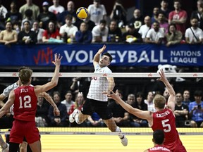 Canada's Eric Loeppky (80) spikes the ball during Volleyball Nations League action against the USA, in Ottawa, on Saturday, June 8, 2024. The Canadian men's volleyball team is on an impressive roll as the Paris Olympics approach. Loeppky had a match-high 21 points as Canada qualified for the Volleyball Nations League quarterfinals by stunning Brazil 3-0 on Friday.