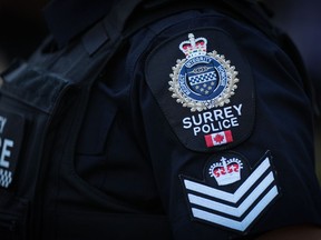A 40-year-old Ontario man with a long criminal history has been charged with second-degree murder in connection with the slaying of 30-year-old Tori Dunn earlier this month. A Surrey police department logo is seen on an officer's uniform in Surrey, B.C., on Wednesday, Aug. 31, 2022.