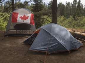 Summer is peak travel season for Canadians, with July the most popular time for a getaway. A recent Deloitte poll found 37 per cent of respondents plan to take a trip during the month.Campers with a Canadian flag flying on their camp site are shown in Algonquin Park in Ontario on Saturday June 12, 2021.