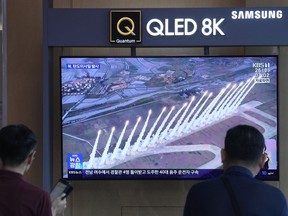 A news program broadcasts a file image of a missile launch by North Korea, at Seoul Railway Station in Seoul, South Korea, Wednesday, June 26, 2024. North Korea fired a ballistic missile toward its eastern waters on Wednesday, South Korea's military said, in an apparent protest of the recent regional deployment of a U.S. aircraft carrier for a new trilateral military drill with South Korea and Japan.