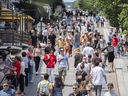 Pedestrians walk in Place Jacques-Cartier in Old Montreal on Sunday, July 4, 2021.