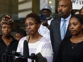 Jacqualyne Johnson, mother of Anthony Johnson Jr., center, is framed by daughters Janell and Chanel while speaking during a press conference outside of the Tim Curry Criminal Justice Center, Tuesday, June 11, 2024, in Fort Worth, Texas. Last week the medical examiner in Tarrant County ruled that Anthony Johnson Jr.'s death was a homicide, citing asphyxia from use of force and pepper spray as the cause of death. Johnson died earlier this year after being restrained in a jail.