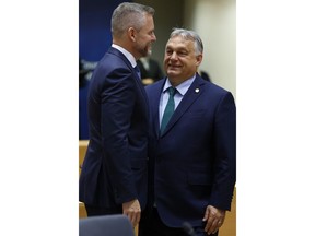 Hungary's Prime Minister Viktor Orban, right, speaks with Slovakia's President Peter Pellegrini during a round table meeting at an EU summit in Brussels, Monday, June 17, 2024. The 27 leaders of the European Union gather in Brussels on Monday evening to take stock of recent European election results and begin the fraught process of dividing up the bloc's top jobs, but they will be playing their usual political game with a deck of reshuffled cards.